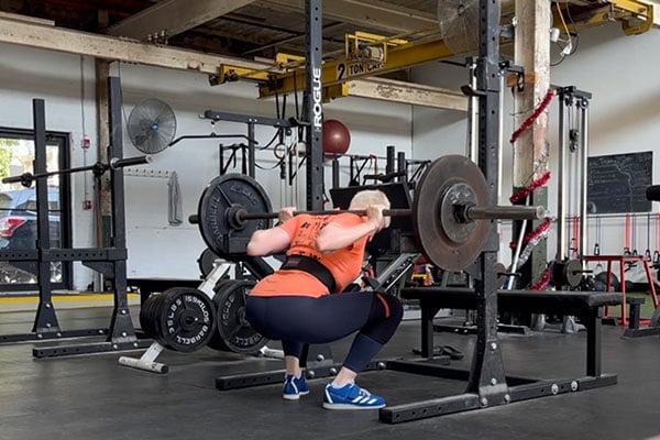 es at the bottom of a squat