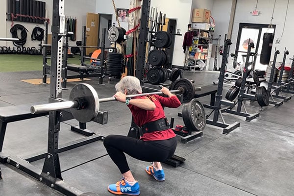 ms at the bottom of a squat at fivex3 training in baltimore