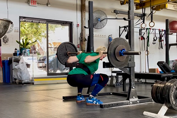 Coach Emily squatting just months after a hip replacement